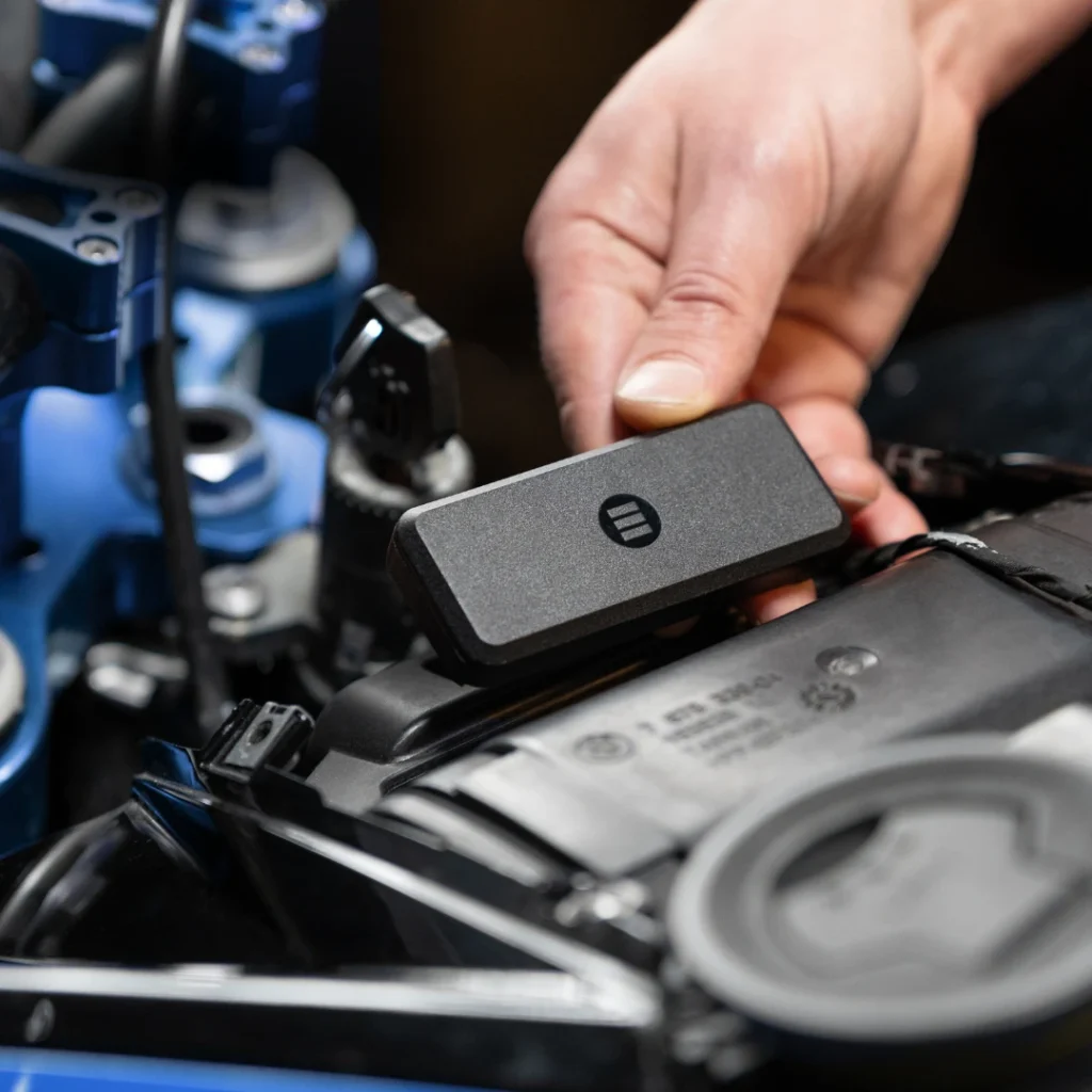 Compact Monimoto 9 GPS tracker hidden on a motorcycle